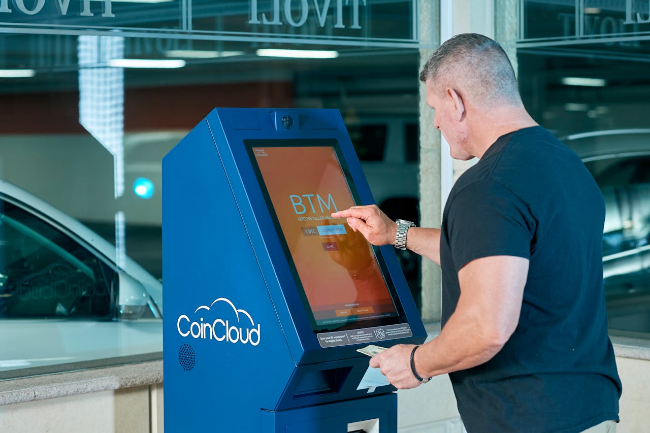 Man standing at Bitcoin ATM