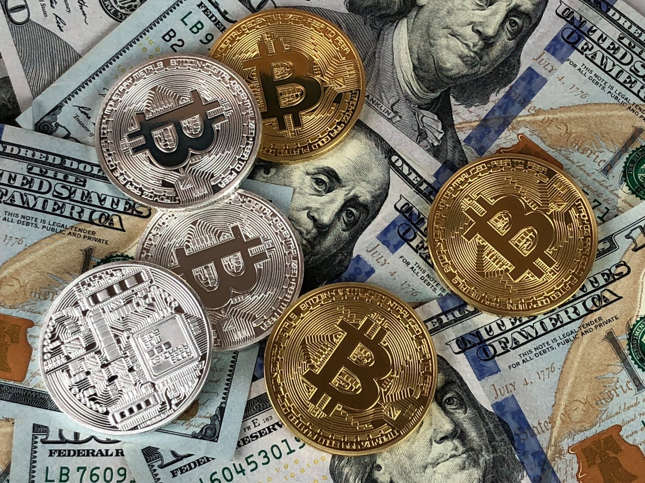 Bitcoins on piles of bank notes