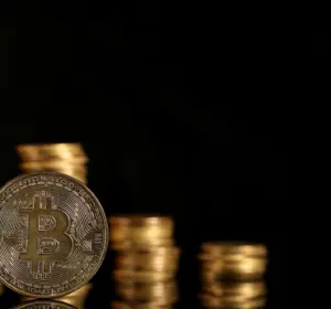 Bitcoin Falls as Oil Spike Revives Inflation Fears