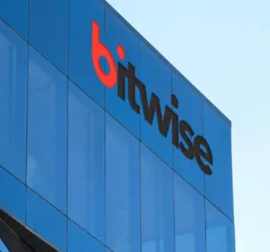 Bitwise company logo mounted on the blue glass exterior of an office building