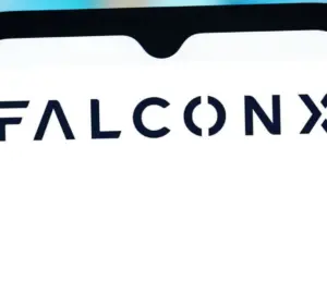 Smartphone screen displaying the FalconX logo against a blurred colorful background