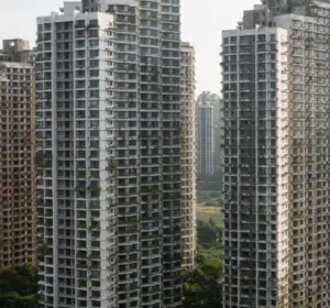 High-rise residential towers at Forest City in Malaysia with additional apartment buildings in the distance.