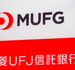 MUFG sign with Mitsubishi UFJ Trust and Banking Japanese lettering displayed on a red and white panel.