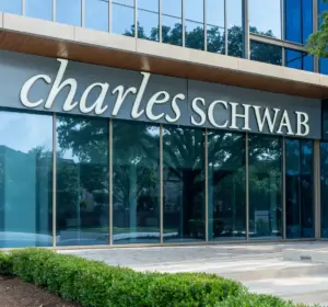 Charles Schwab signage on the exterior of a modern office building
