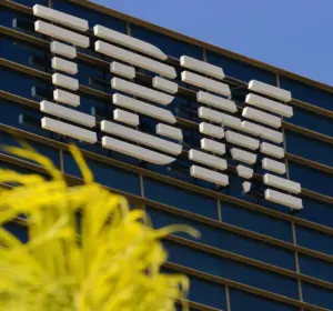 IBM logo mounted on the exterior of a modern office building